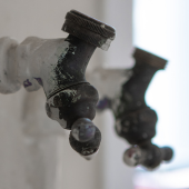 A pipe and fixtures in an older Evanston home. Many of the water lines that service Evanston are made of lead and need replacement. Credit: Adina Keeling