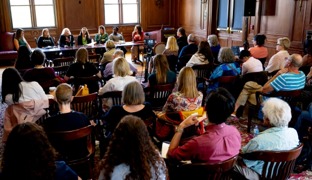 Photo of panelists speaking in front of room