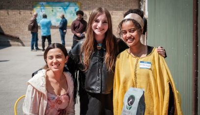 3 students pose for a photo during an event abroad.