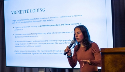 A student presenting research findings at an event