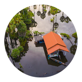 home surrounded by floodwaters in Thailand