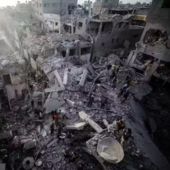 Palestinians inspect the damage after an Israeli strike on the Nuseirat refugee camp in the central Gaza Strip on Dec. 7, 2024.