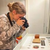 Buffett Undergraduate Research Fellow Elizabeth Lowry photographing artifacts while conducting archival research in Europe