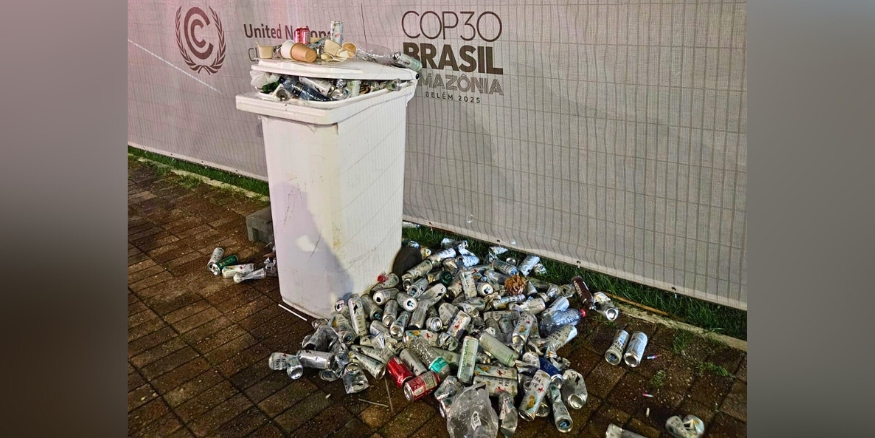 COP30 brand canned water overflowing onto the street