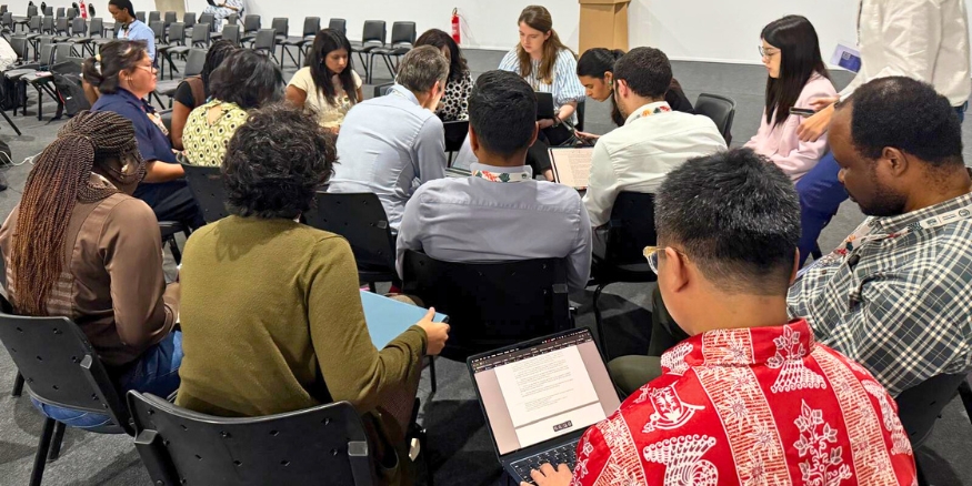 Bambang taking notes during one of the negotiations