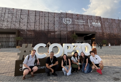 Students in front of COP30 sign