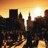 A crowd of pedestrians on a Chicago street during a heat wave.