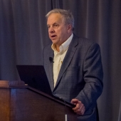 Ian Kelly talking at podium