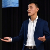 Headshot of author Max Ng presenting research.