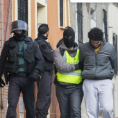 One of four people suspected of creating and operating several Internet platforms to recruit young women to join the Islamic State group is arrested in Melilla, the Spanish enclave neighboring Morocco, Feb. 24, 2015. (Angela Rios/AFP via Getty Images)