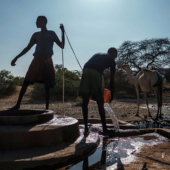 Men extract water from a well at the village of El Gel, near the town of K'elafo, Ethiopia. Getty Images