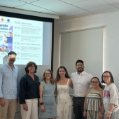 A group photo of César Enrique Hoyos Álvarez and Claudia Quevedo-Webb at their conference supporting neurodivergent individuals.