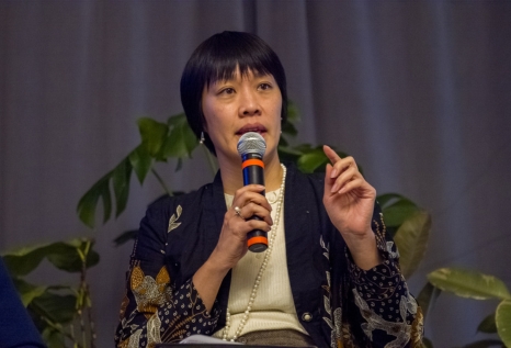 Faculty talking on stage