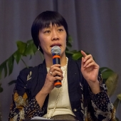 Faculty talking on stage