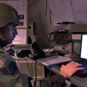 Soldier looking at a computer