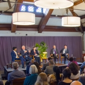 Speakers talking on stage