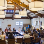 Professor Danielle Gilbert talking to undergraduate participants in the peace conference simulation.