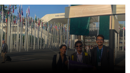 Northwestern students in front of the entrance to COP28, the United Nations 2023 climate change conference